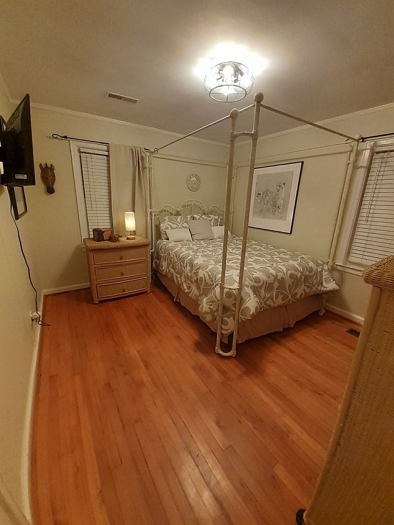 Queen size bed with memory foam mattress. Room is 12 x 11. The bedroom has blackout shades and a 32-inch Roku TV.