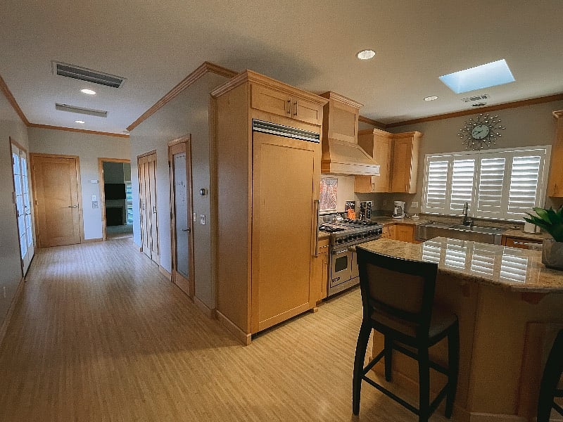 Hallway leading to laundry, bedroom, bathroom & rooftop access. 