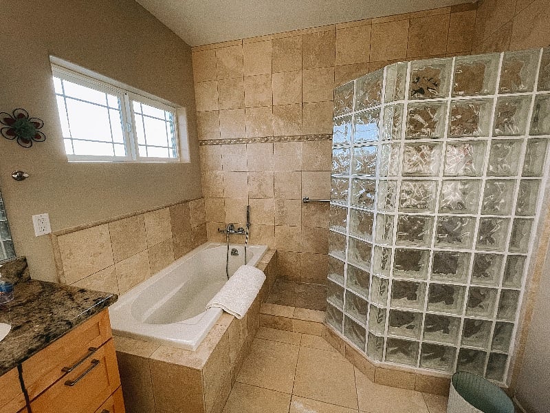 Upstairs Full Bathroom 2 with double vanity, large tub and walk in shower.