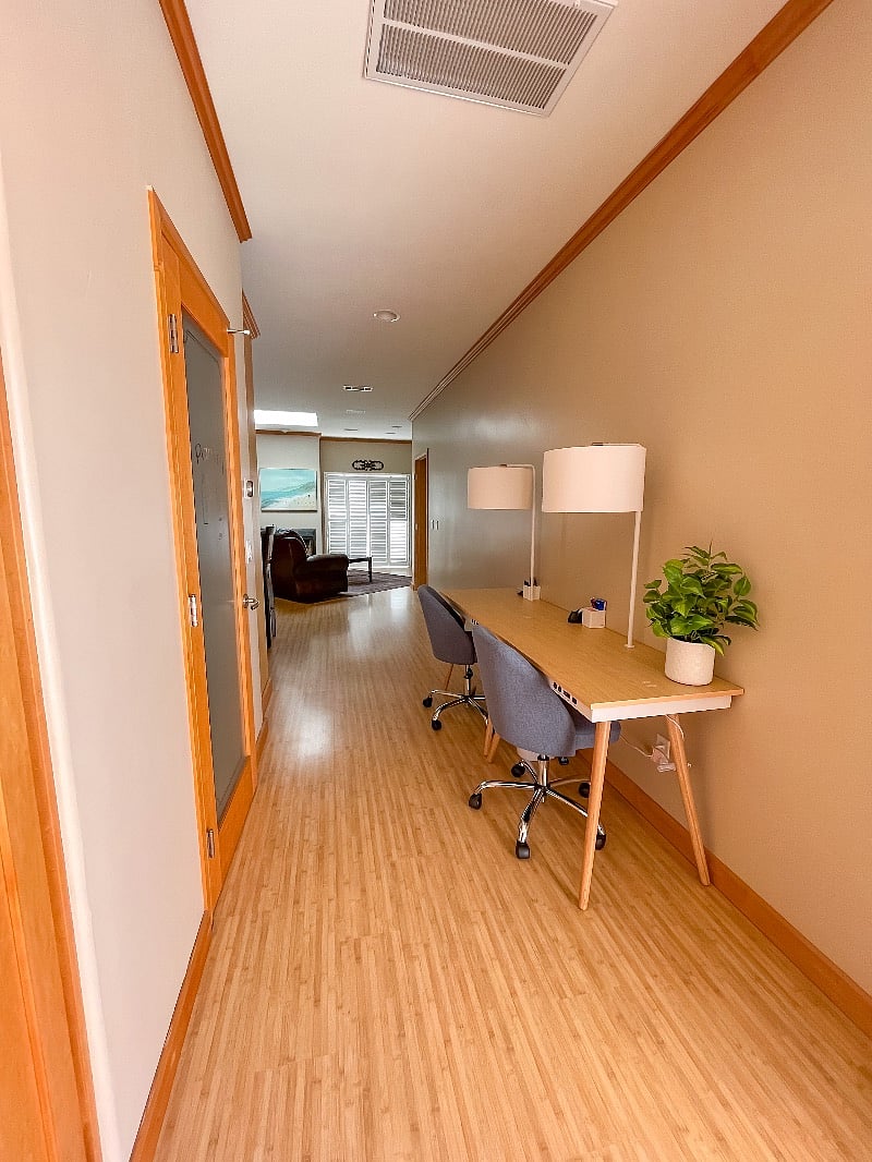 Office area with 2 desks off of the living room & kitchen