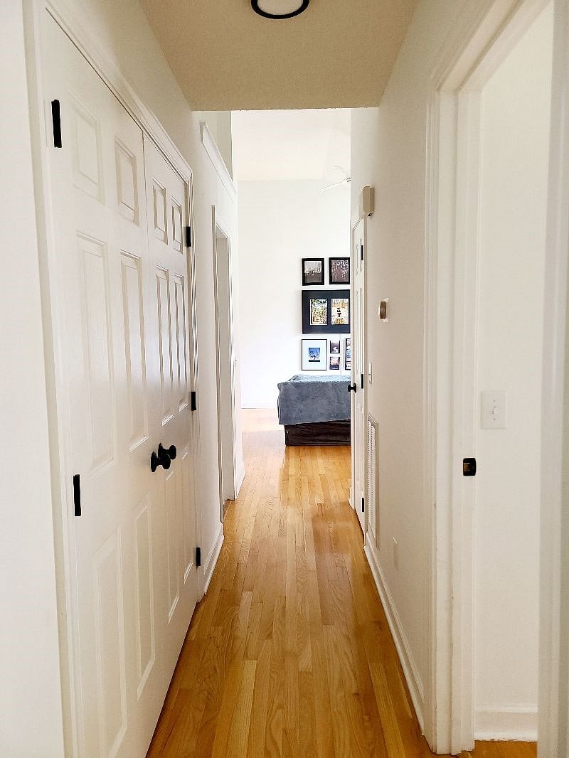 View of living area from garage entry hallway.