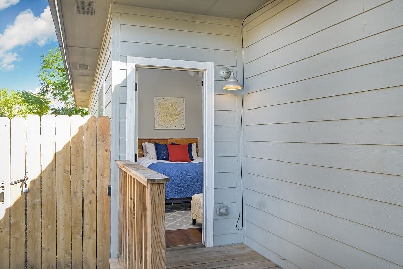 Bedroom 2 exterior door leading to the front yard.