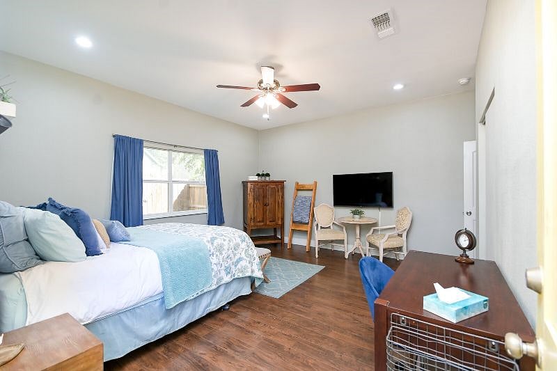 Bedroom 1 with queen size bed and desk.