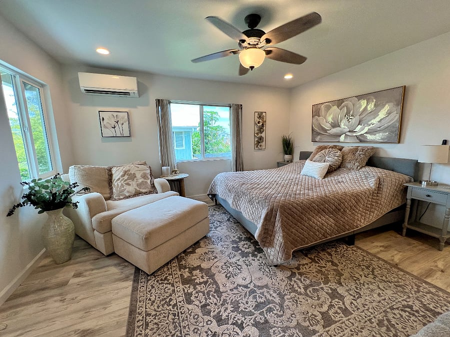 Upstairs Master Bedroom with Reading Lounge, Smart TV, walk-in closet and en-suite bath.