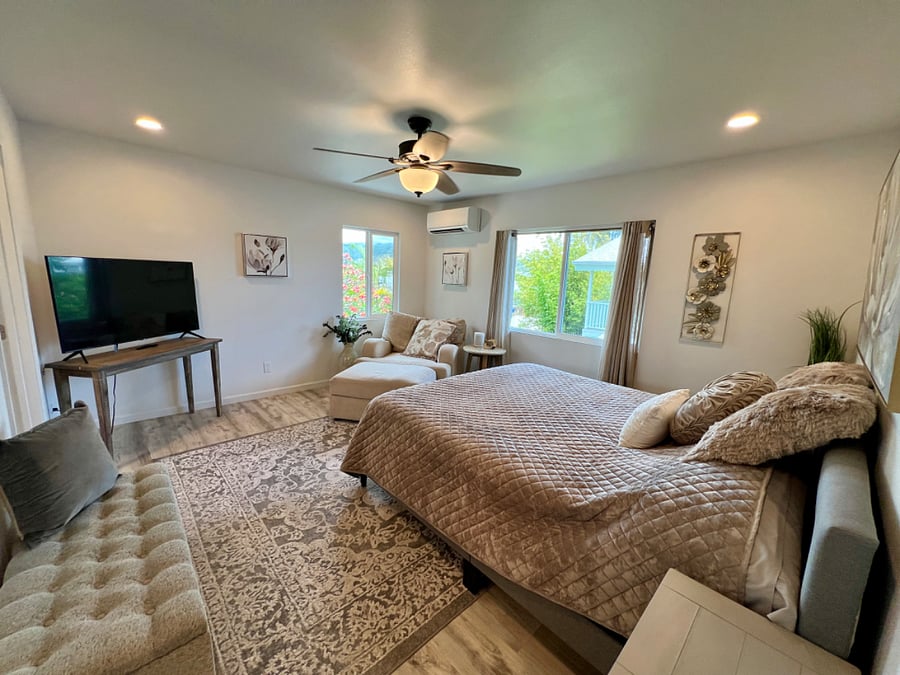 Upstairs Master Bedroom with Sitting area, Smart TV, walk-in closet and en-suite bath.