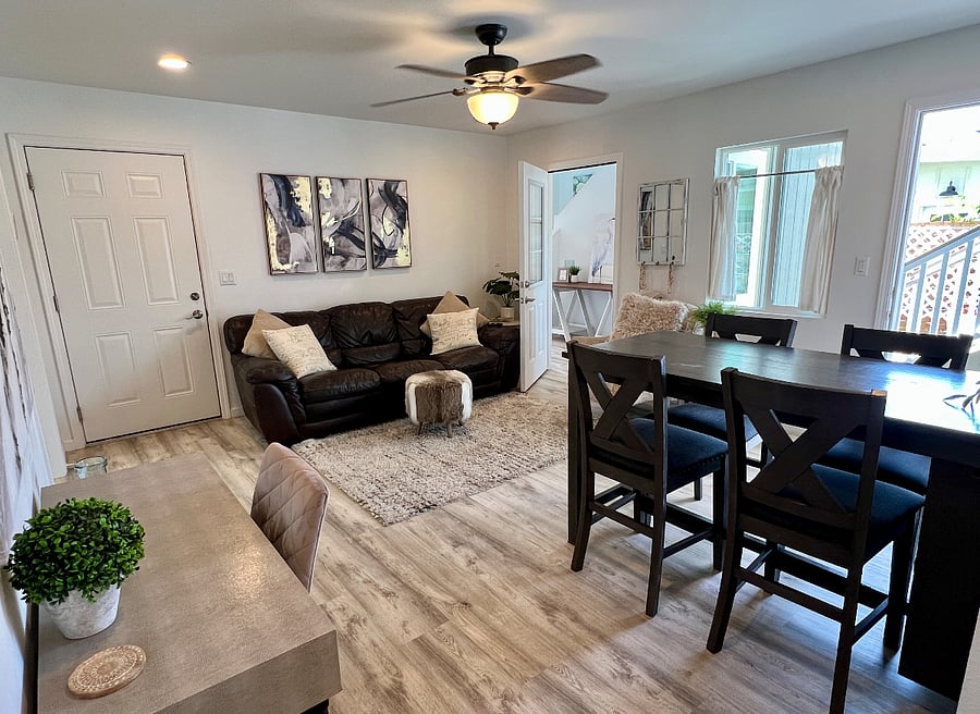Downstairs 3Bed/1Bath Dining and Living Area (corner door leads to stairs to upper 4Bed/2Bath unit).