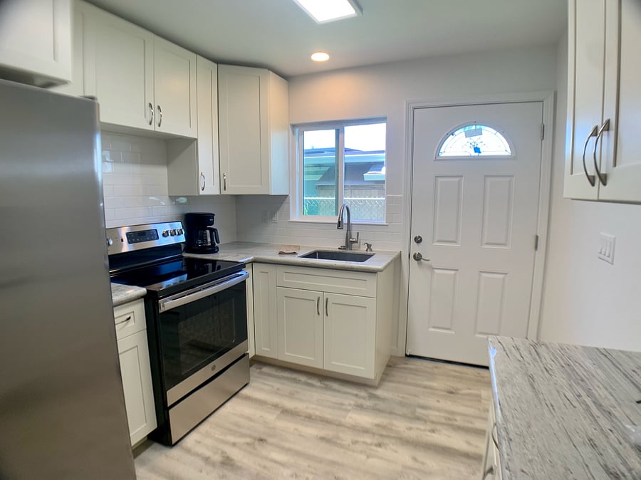 Downstairs 3Bed/1Baths Fully stocked Kitchen with Full-size fridge, range, and large sink
