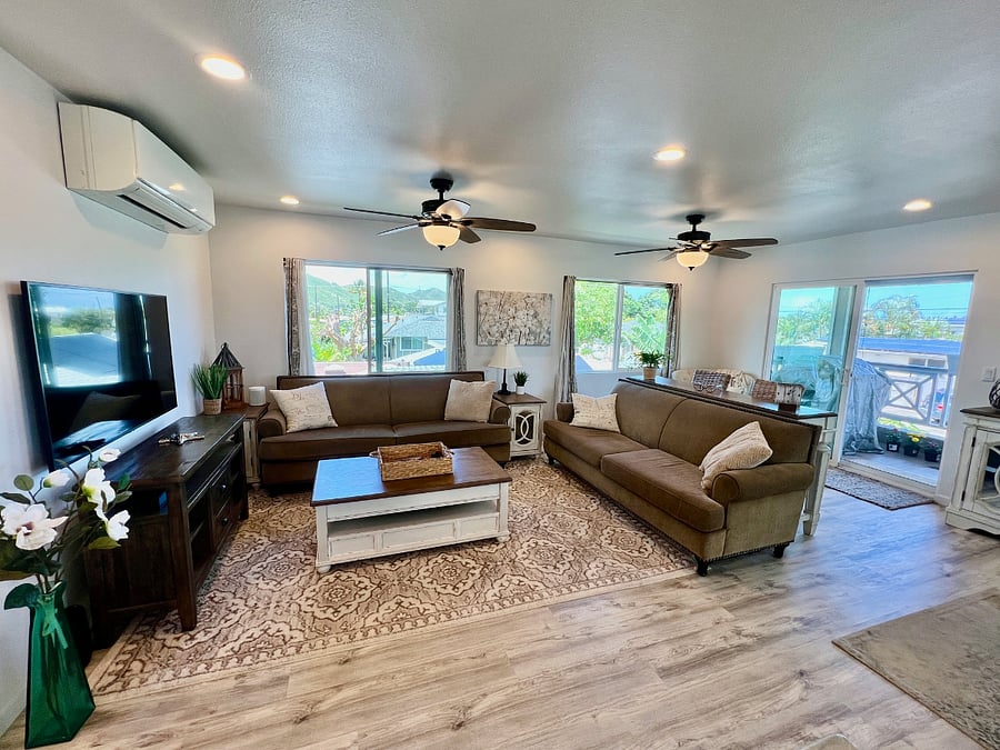 Upstairs Living Area with 2 large sofas, coffee table with raisable worktop