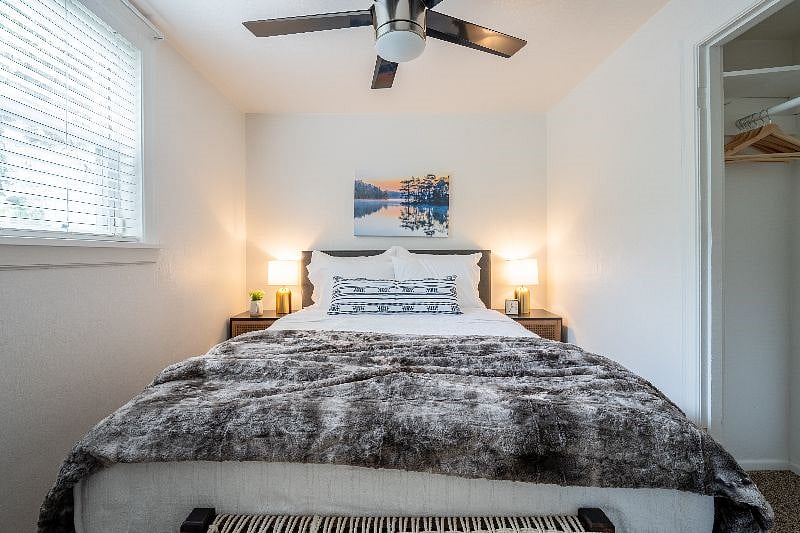 Queen room with closet and double nightstand storage