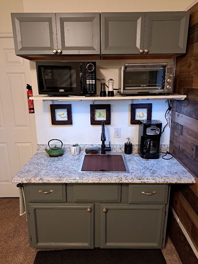 Kitchenette with microwave and toaster oven and coffee and tea