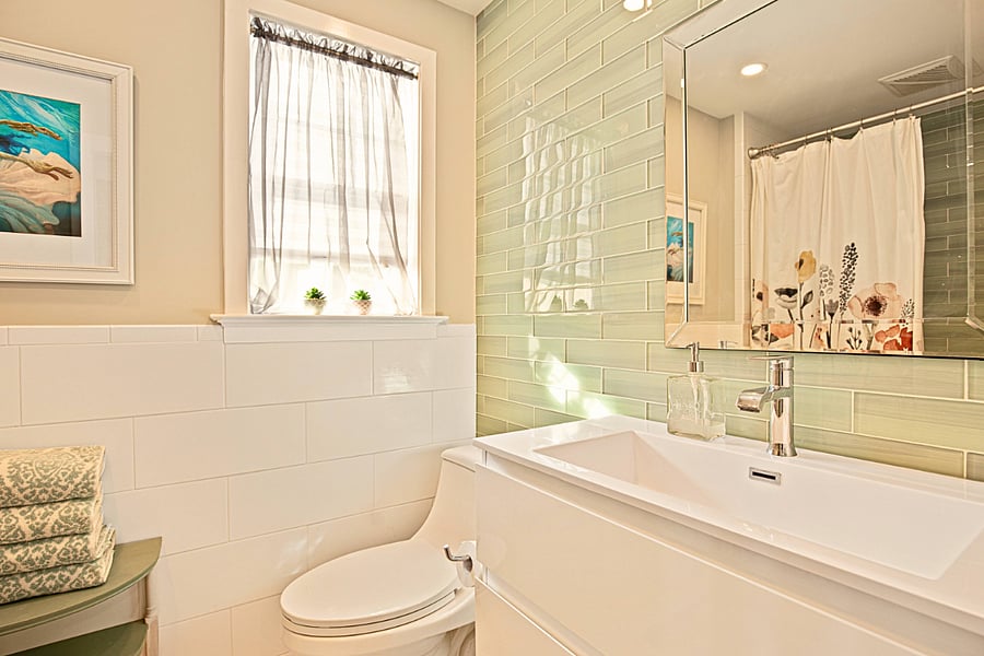 The walk-in shower and modern fixtures add to the relaxing atmosphere to this newly renovated bathroom.