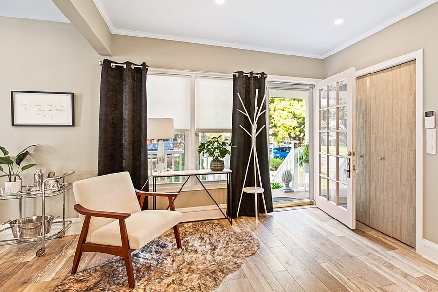 Curl up in the mid-century reading chair with a book and natural light from the front windows.