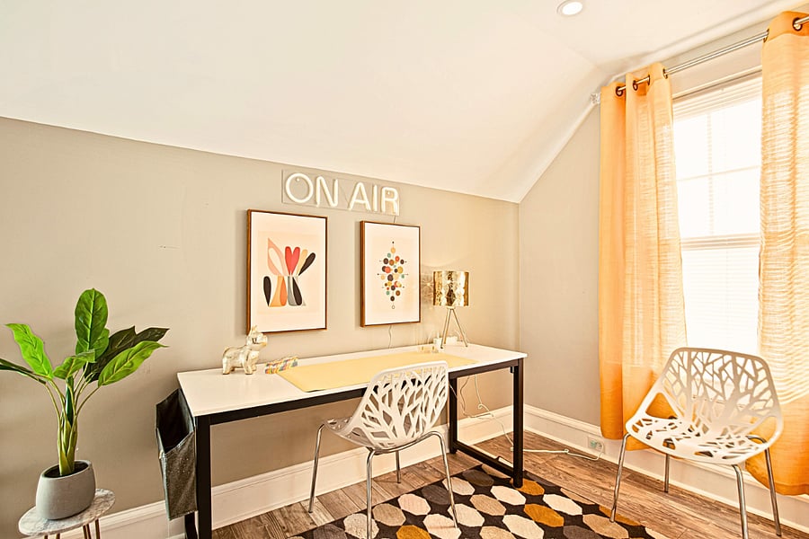 The cheerful yellow accents bring playful energy! Full desk, natural light, and extra seating make this office perfect for Zoom calls or focused work near Downtown Richmond.