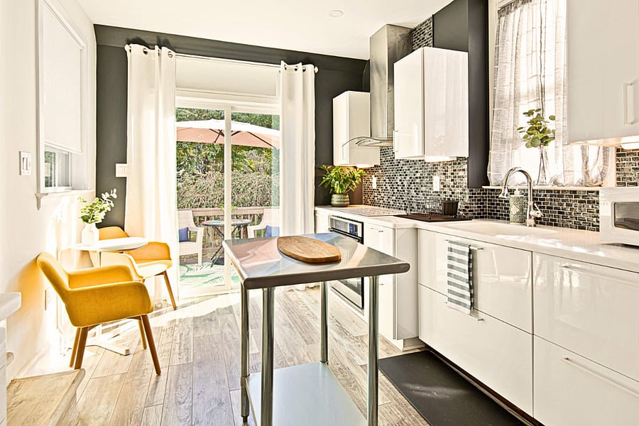 Stainless steel appliances, stunning tile backsplash, and direct access to the deck where kids can play in the fenced backyard while you prepare your favorite breakfast.