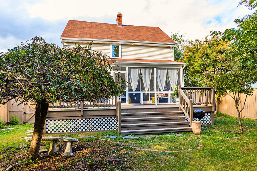 Two outdoor spaces mean everyone finds their spot - screened porch for bug-free lounging, open deck for sun and BBQ. The fenced yard below keeps kids and pets safe while adults relax above.