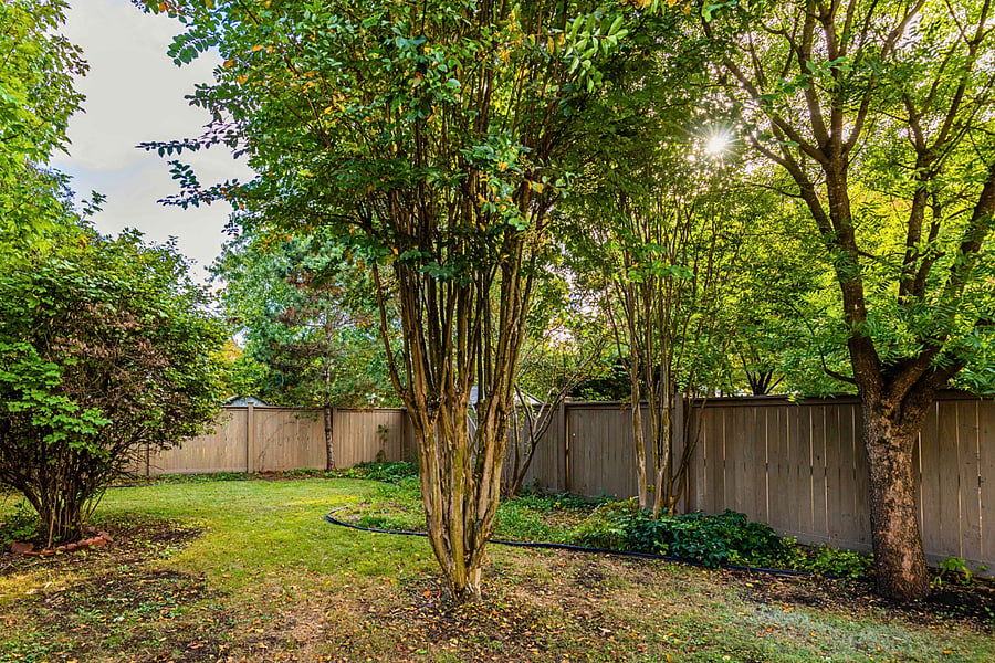 The backyard is perfect for children and pets with a large, fully fenced yard. Relax on the deck or cook in the kitchen with backyard views.