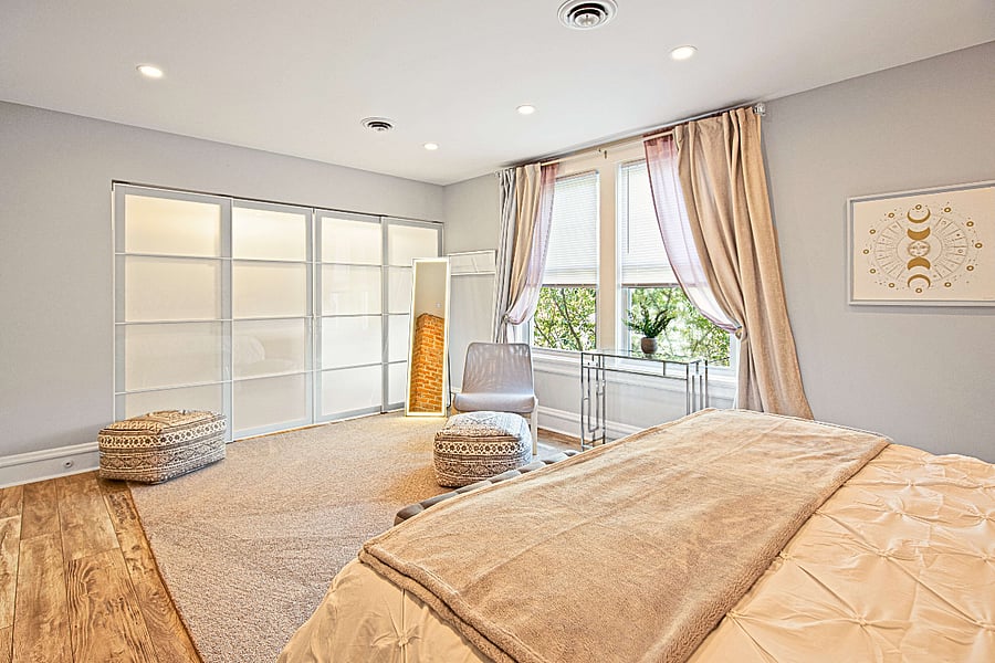The master bedroom's generous closet space, full length mirror and soft natural light make long stays joyful.