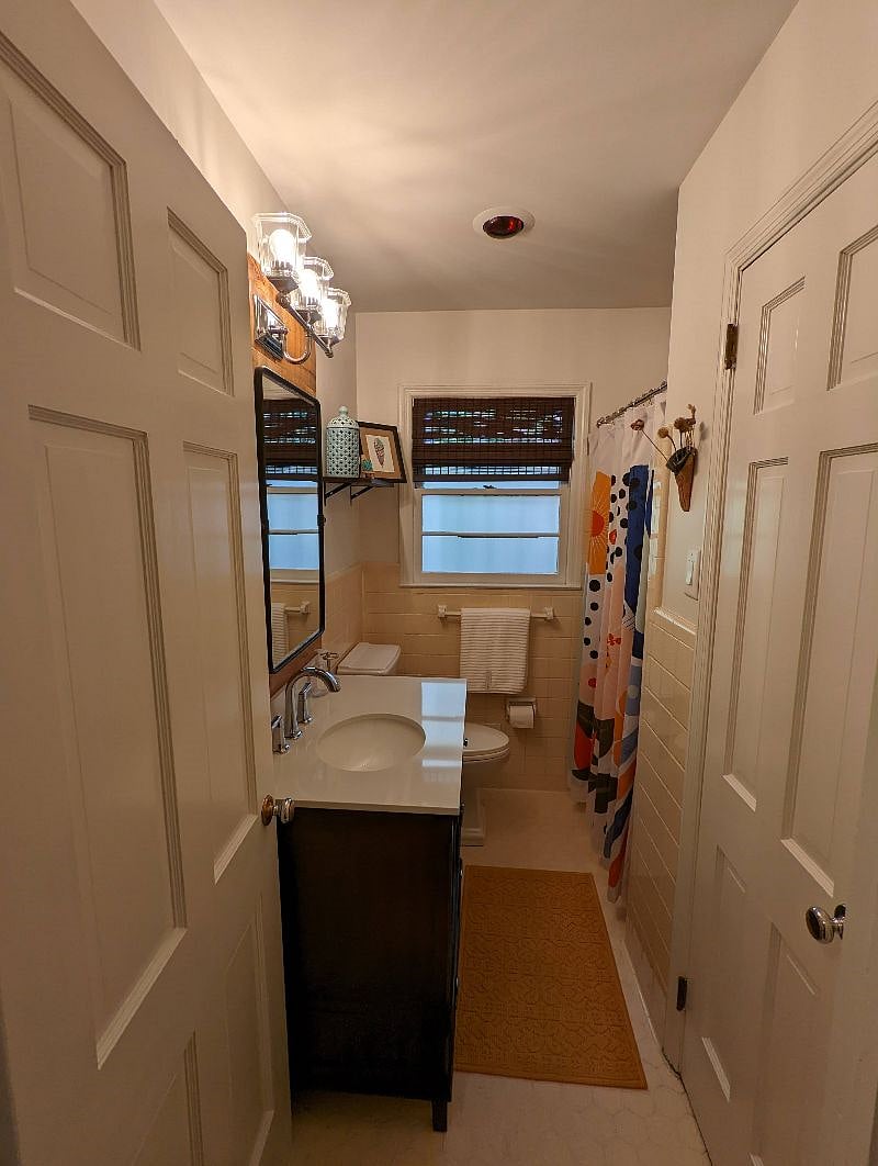 Private bathroom with shower and large linen closet
