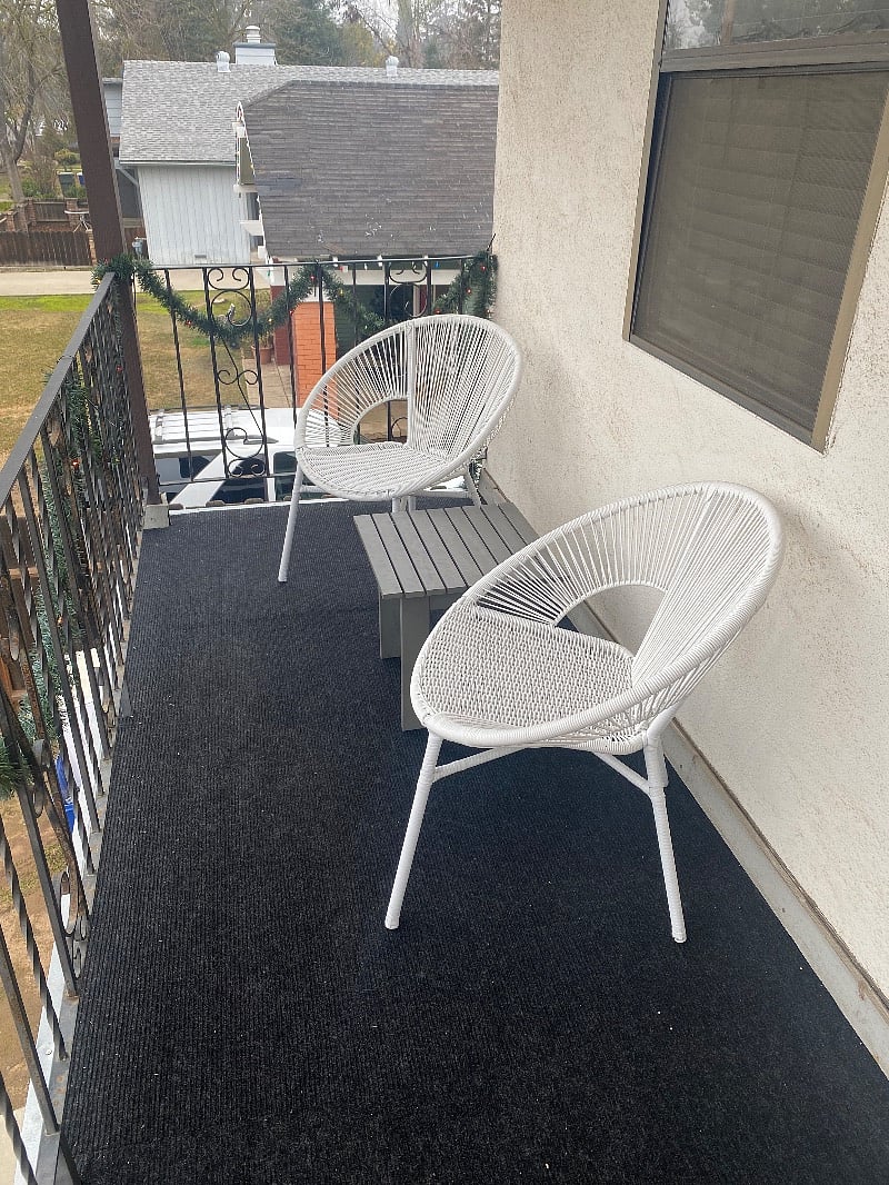your private south-facing balcony with seating area.