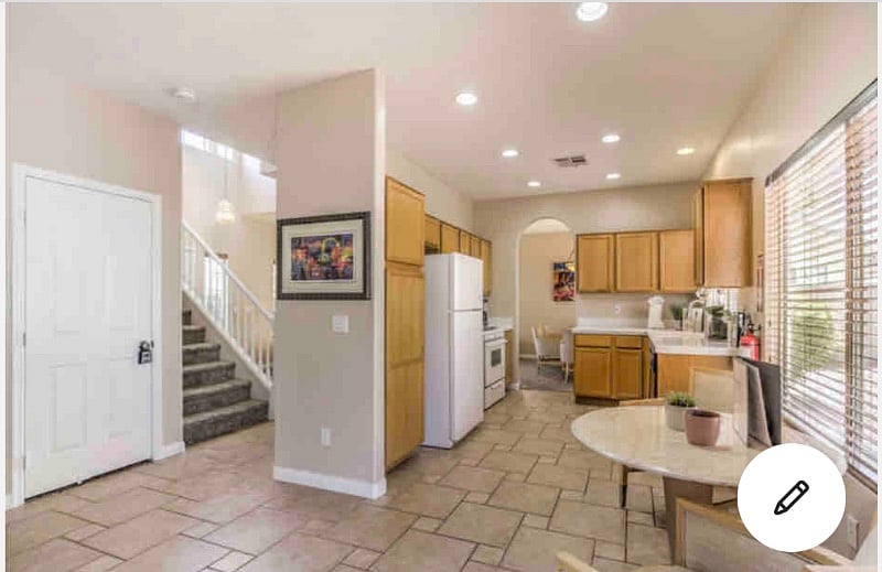 Kitchen view from den and walking in patio.