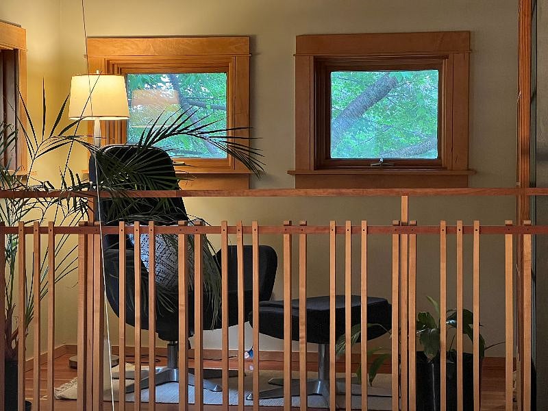 Owner reading loft off primary bedroom - overlooking living room - N/A