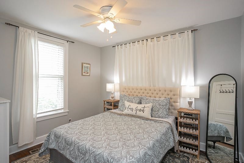 Bedroom #2 with a queen bed, dresser, and closet