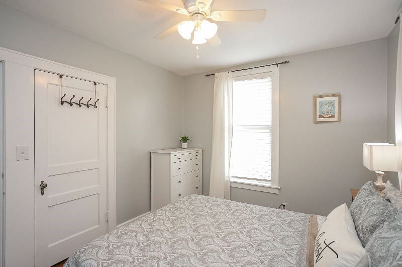 Bedroom #2 with a queen bed, dresser, and closet