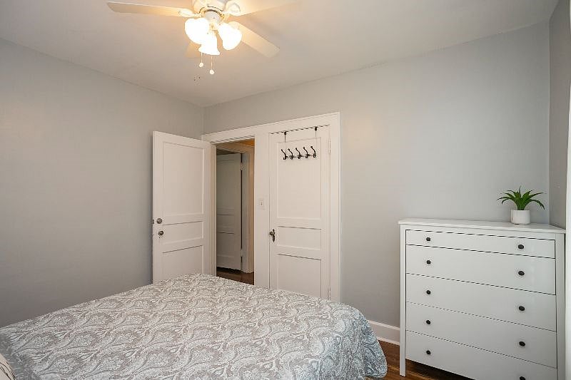 Bedroom #2 with a queen bed, dresser, and closet