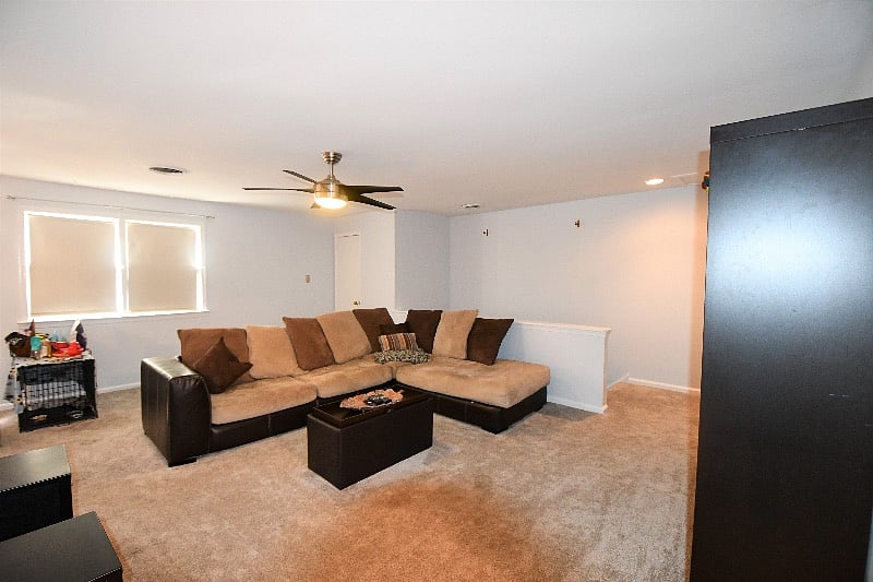 Coat closet behind sofa