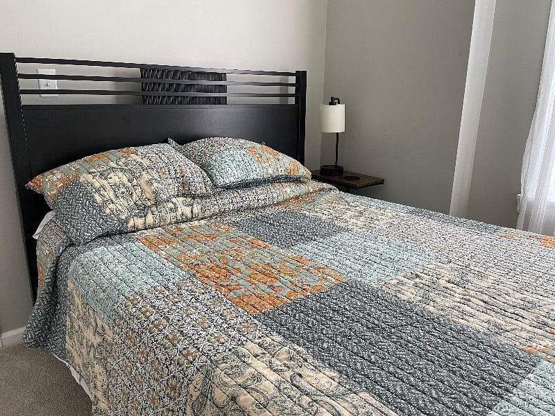 second bedroom with queen size Nectar mattress and night stand with charging station