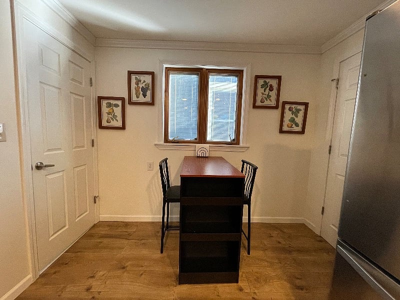 small eating area or additional work space in kitchen - door on left goes to half bath and door on right goes to multi-purpose room