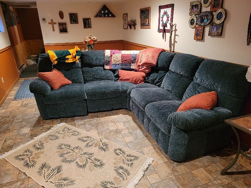 Spacious living area, comfy couch with recliners.