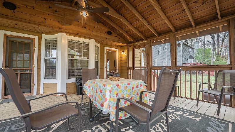 Screened porch with entrance to master bedroom and den areas