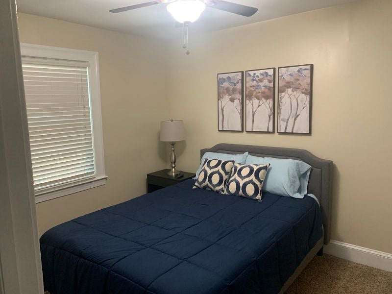 Queen bedroom with TV