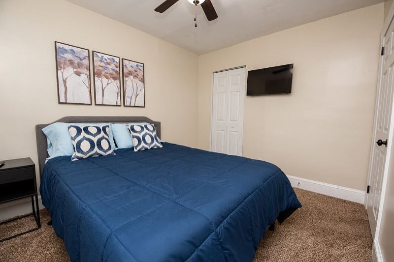 Queen bedroom with TV