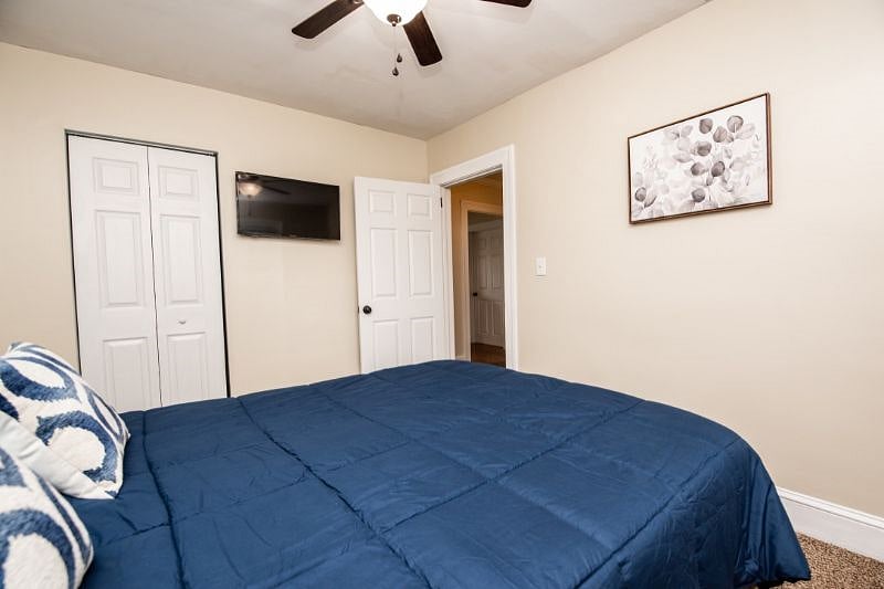 Queen bedroom with TV