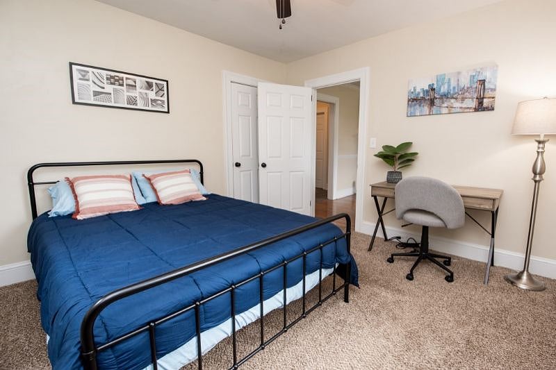Queen bedroom with workspace