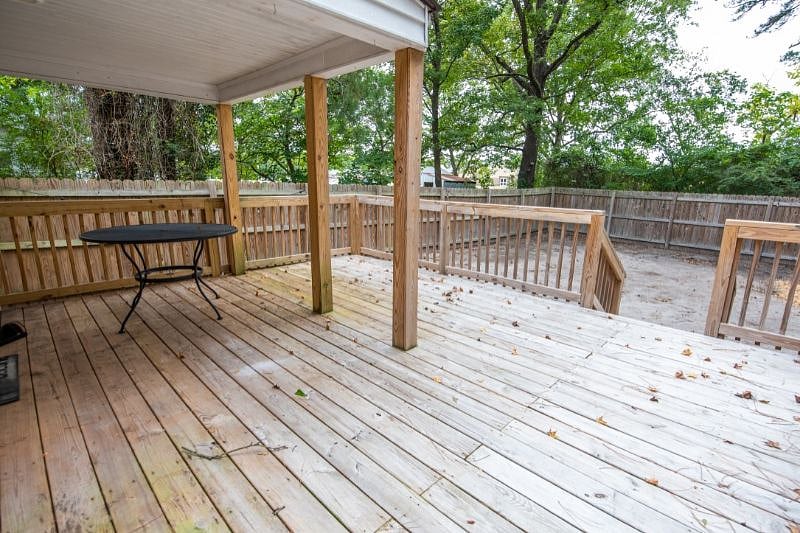 Back deck with covered area, table and four chairs
