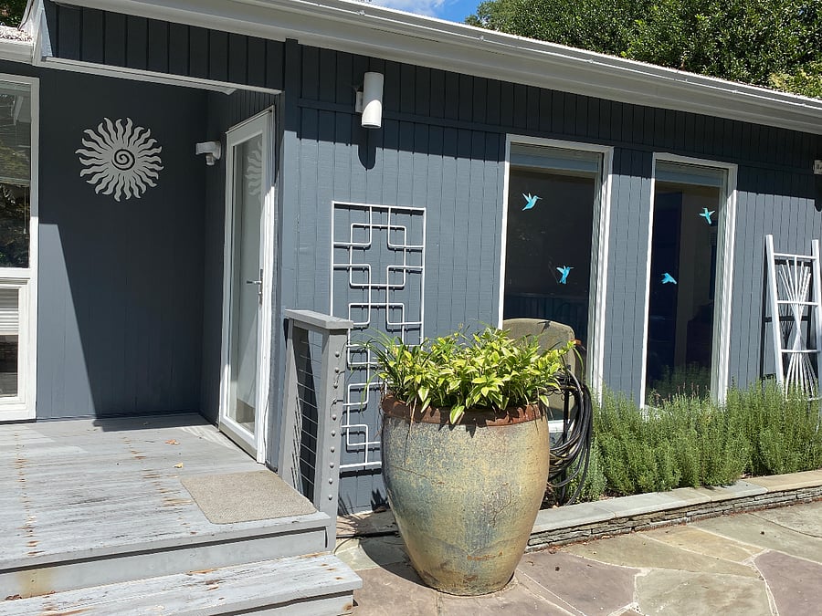 Private front entrance has two steps up