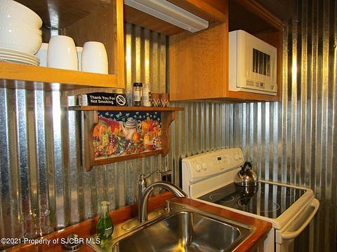Full size refrigerator, stove & oven with all the kitchen necessities.
