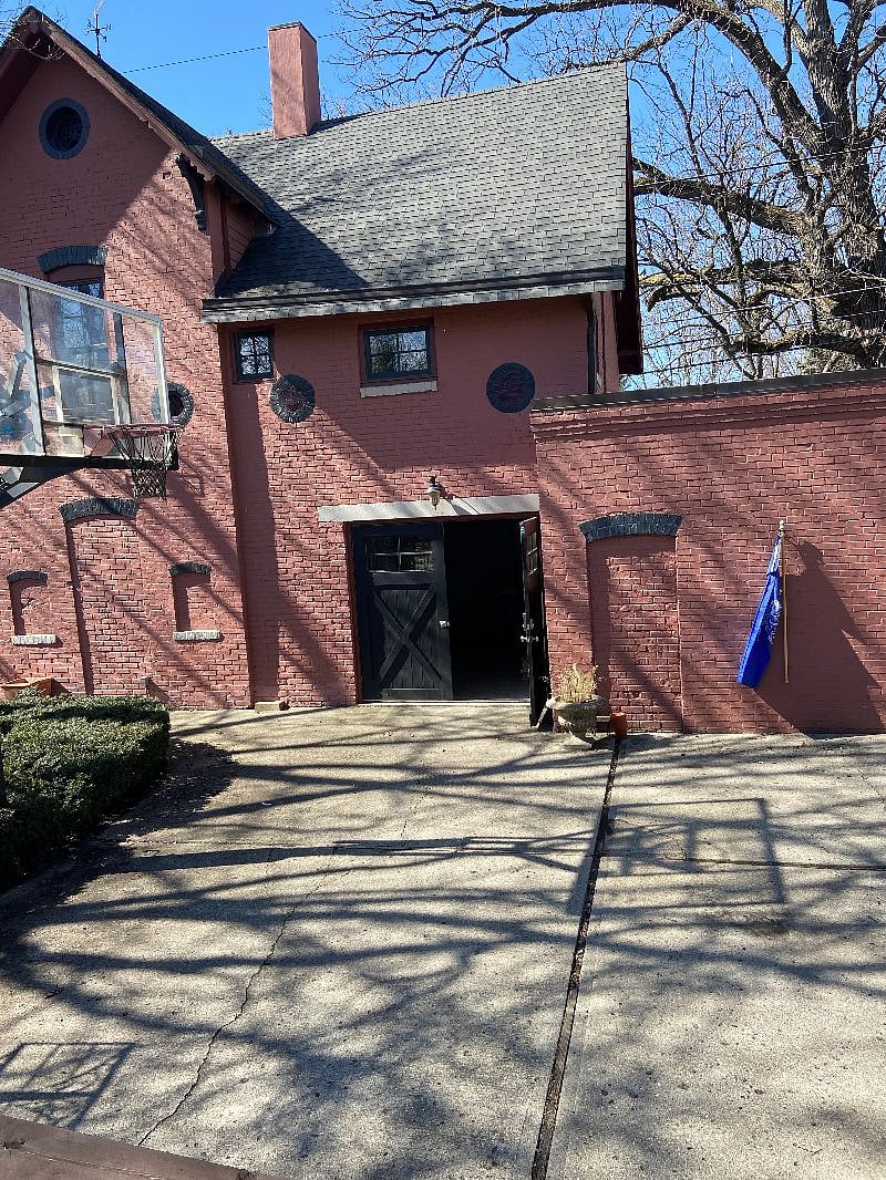 double doors lead to garage where apartment entrance is. garage is used for storage