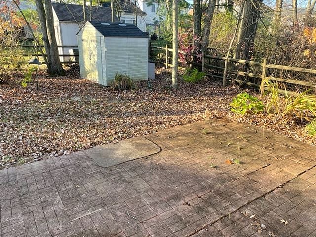 fenced backyard with patio