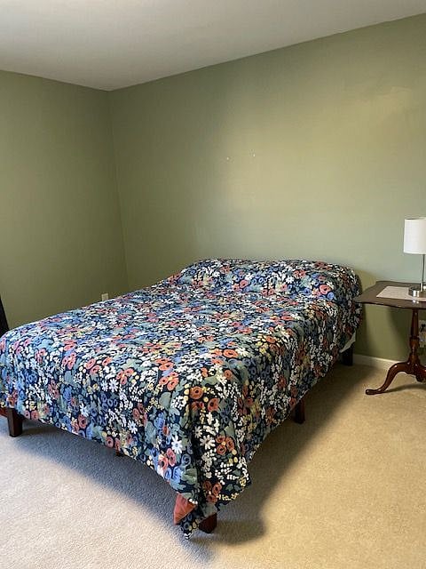 large bedroom facing front shares bathroom with additional room