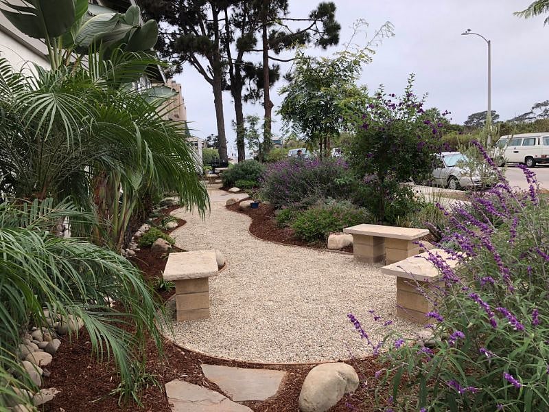 The front yard includes a BBQ for your use as well as a seating area