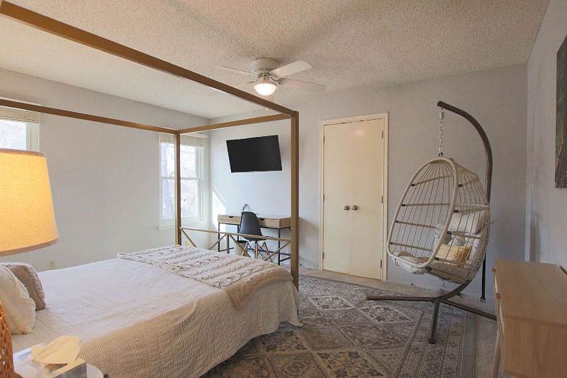 The Peace Room has a desk, SMART TV, swing, ceiling fan and touch on and off lamps