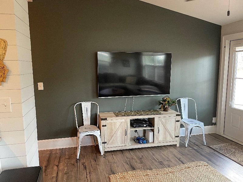Living room with frenchdoors that open to backyard and deck