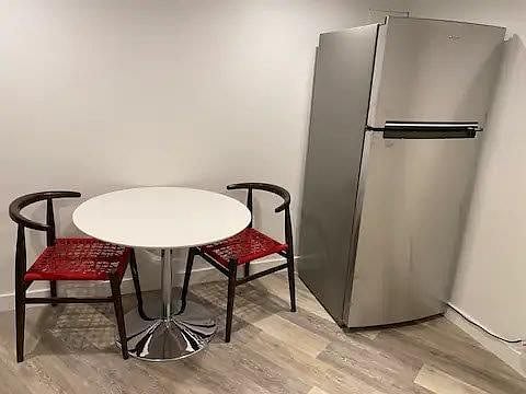 Table and chairs in Kitchenette with Full Size Refrigerator