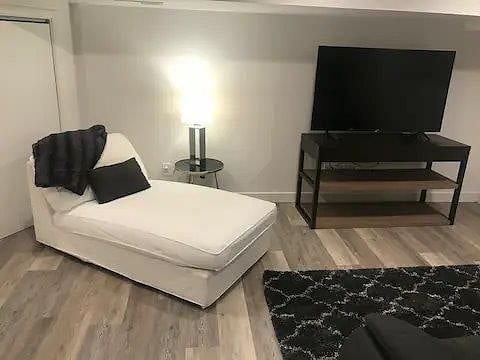 Chase Lounge with 55" Smart TV and side table and lamp