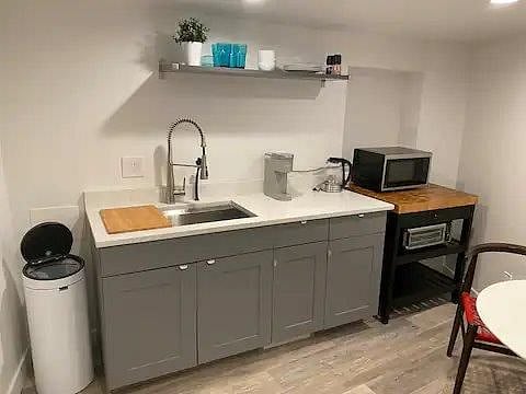 Kitchenette complete with large sink and disposal, coffee maker, microwave, Air fryer/convection oven, hot water pitcher. Complete with all dishes, glassed and utinsels.