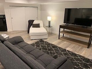 Sitting Room adjacent to Queen Bed, 2 Room Suite with Private Bathroom and Kichenette in adjacent room.